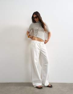 Model wearing Stripe high neck ruffle button through half sleeve top in neutral