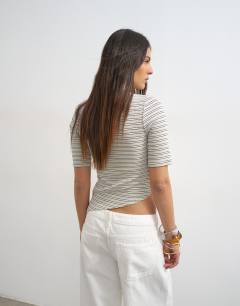 Model wearing Stripe high neck ruffle button through half sleeve top in neutral