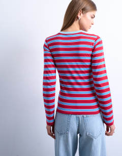 Model wearing Stripe long sleeve everyday tee in red and blue