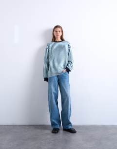 Model wearing Stripe long sleeve slouchy skater tee in blue