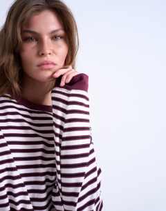 Model wearing Stripe long sleeve slouchy skater tee in burgundy