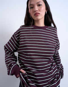 Model wearing Stripe long sleeve slouchy skater tee in burgundy