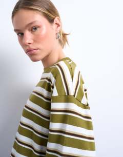Model wearing Stripe long sleeve slouchy skater tee in khaki 