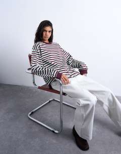 Model wearing Stripe long sleeve slouchy skater tee in mint and burgundy