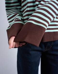 Model wearing Stripe oversized deep cuff sweat in mint and chocolate