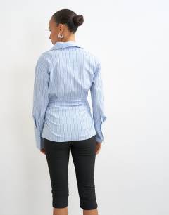 Model wearing Stripe poplin cinch waist shirt in blue