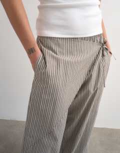 Model wearing Stripe poplin wrapover skirt trouser in brown