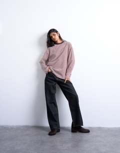 Model wearing Stripe premium interlock long sleeve skater tee in brown