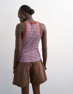 Model wearing Stripe rib racer vest in brown