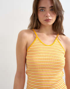 Model wearing Stripe rib spaghetti strap curve hem vest in orange