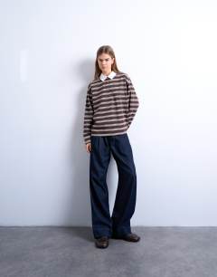 Model wearing Stripe rugby long sleeve polo top in chocolate