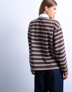 Model wearing Stripe rugby long sleeve polo top in chocolate