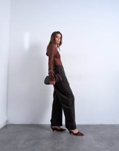 Model wearing Stripe tailored barrel leg trouser