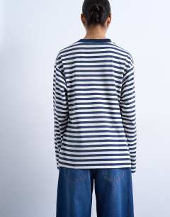 Model wearing Stripe tuck waist tee in blue & white