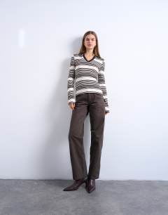 Model wearing Stripe v-neck polo long sleeve top in chocolate and ecru