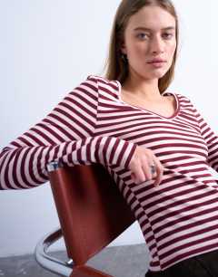 Model wearing Stripe v-neck top in pink and burgundy