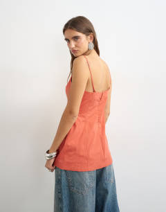 Model wearing Structured cami in rust