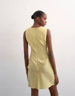 Model wearing Structured drape mini dress in soft lime