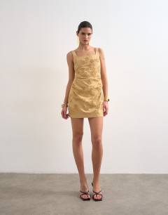 Model wearing Structured drape mini dress with 3D flowers in beige