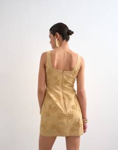 Model wearing Structured drape mini dress with 3D flowers in beige