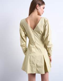 Model wearing Structured flippy hem mini dress in buttermilk