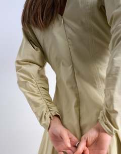 Model wearing Structured flippy hem mini dress in buttermilk