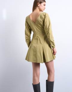 Model wearing Structured flippy hem mini dress in olive