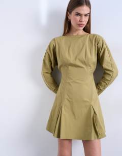 Model wearing Structured flippy hem mini dress in olive