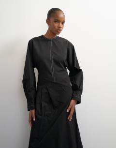 Model wearing Structured midi dress with tie waist detail and batwing sleeve
