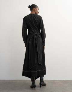 Model wearing Structured midi dress with tie waist detail and batwing sleeve