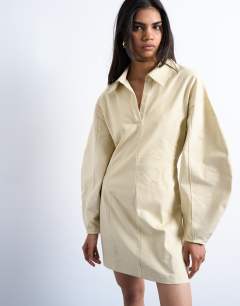 Model wearing Structured rugby collar mini dress in beige