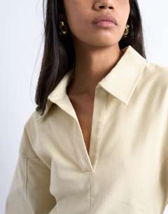 Model wearing Structured rugby collar mini dress in beige