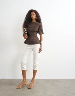Model wearing Structured short sleeve ruched side top in chocolate