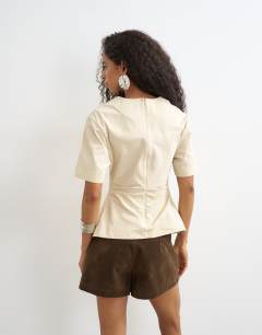 Model wearing Structured short sleeve ruched side top in stone