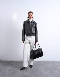 Model wearing Suki hair on real leather shoulder bowler bag in chocolate