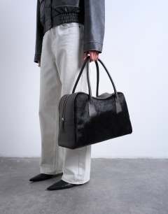 Model wearing Suki real leather shoulder bowler bag in chocolate pony