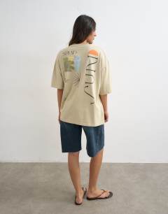 Model wearing Sun Drenched graphic oversized tee in multi