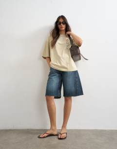Model wearing Sun Drenched graphic oversized tee in multi