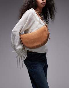 Model wearing Sunday real leather suede shoulder bag in tan