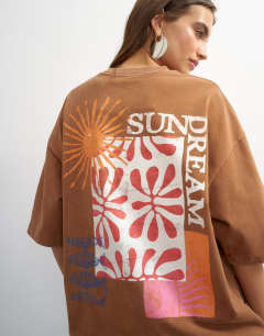Model wearing Topshop 'Sundream' graphic embroidered detail oversized t-shirt in brown