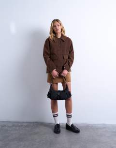 Model wearing Sunrise pocket shoulder nylon bag in black