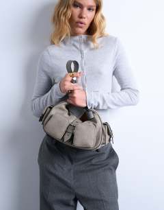 Model wearing Sunrise pocket shoulder suede bag in taupe