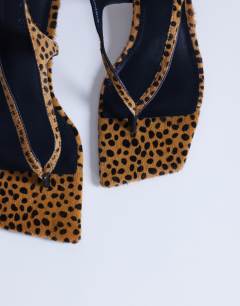 Model wearing Sunshine toe thong mid heel sandal in deer print hair on real leather 