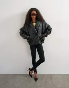 Model wearing Super oversized faux leather shawl collar bomber jacket in black