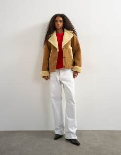 Model wearing Super oversized faux shearling short jacket in beige