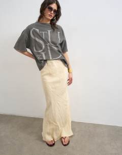 Model wearing Super soft cupro bias midi in buttermilk