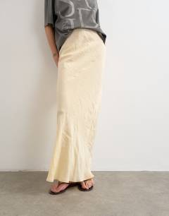 Model wearing Super soft cupro bias midi in buttermilk