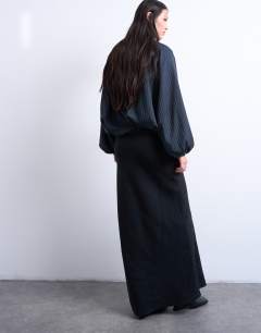 Model wearing Super soft cupro bias midi skirt in charcoal