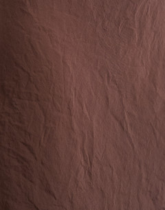 Model wearing Super soft cupro bias midi skirt in chocolate