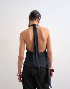 Model wearing Super soft cupro halter neck in black